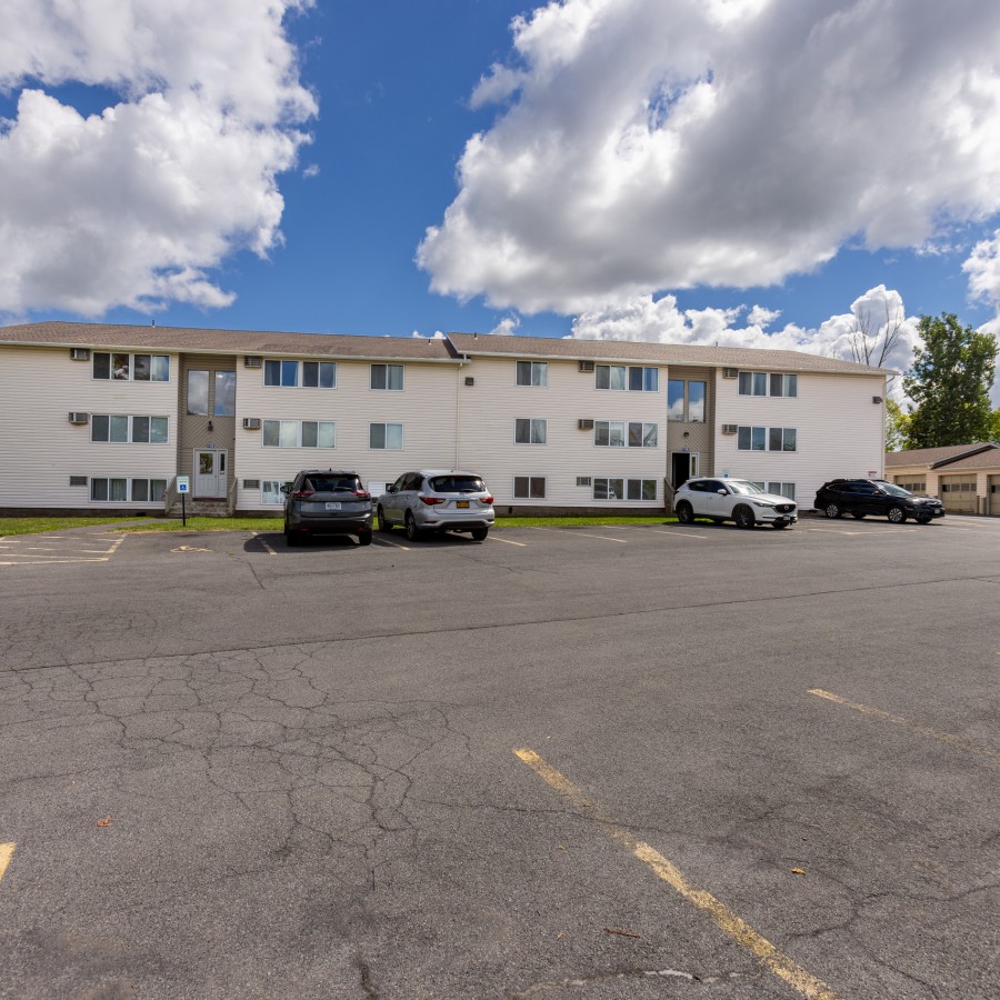 Long apartment building and garages across the parking lot at Brook Manor Apartments, Syracuse NY
