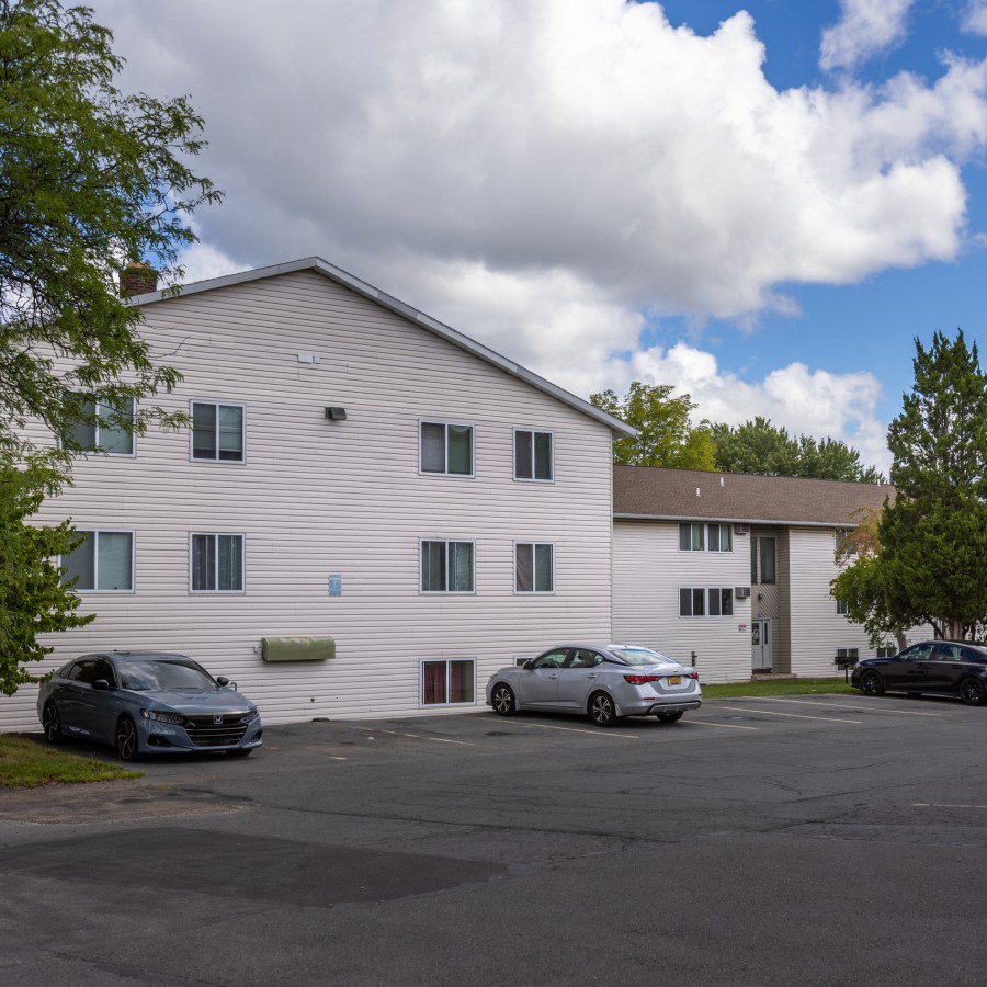 End of an apartment building and parking at Brook Manor Apartments, Syracuse NY