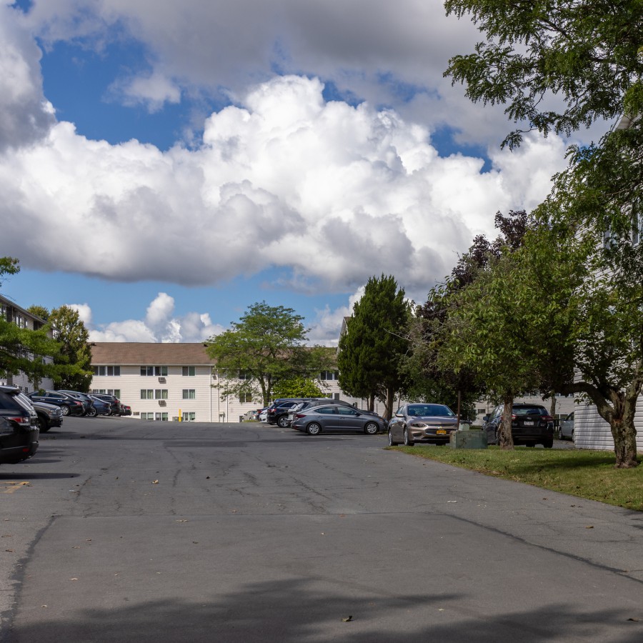 Driveway and parking between apartment buildings at Brook Manor Apartments, Syracuse NY