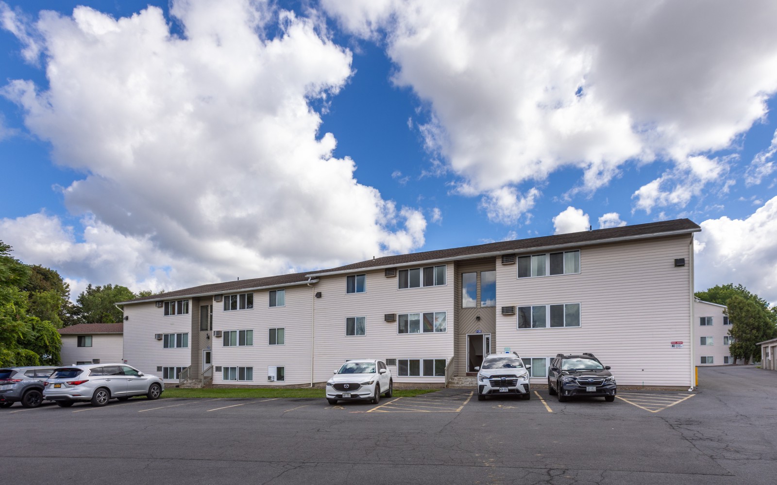 Front of a three-story apartment building at Brook Manor Apartments, Syracuse NY